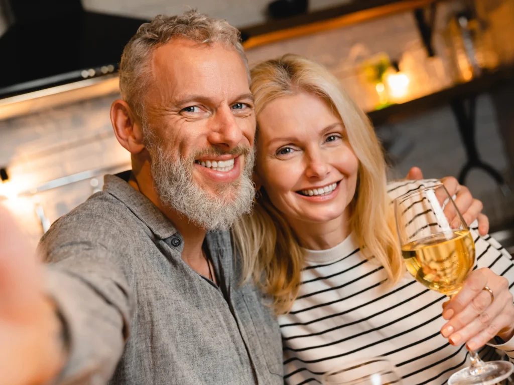 Happy married couple smiling together after cosmetic dentistry at Bartow Dental Arts in Bartow, FL