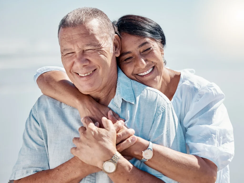 Senior couple smiling with white teeth after a teeth cleaning in Bartow, FL at Bartow Dental Arts